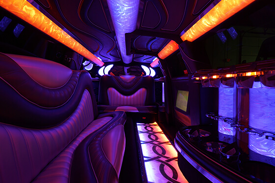 luxury limo interior with colorful lights and elegant leather seating