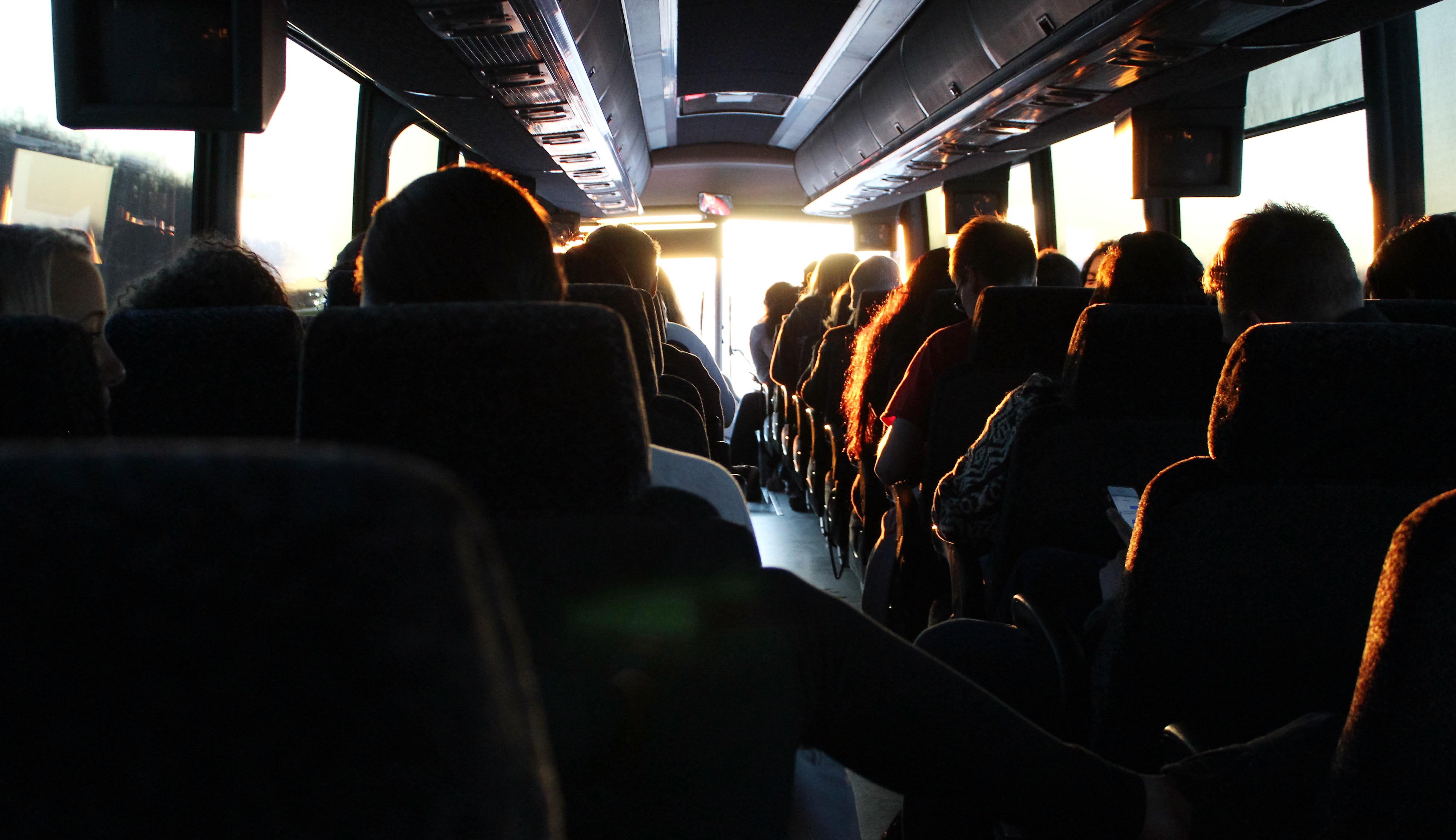 People enjoying field trips in a charter bus rental